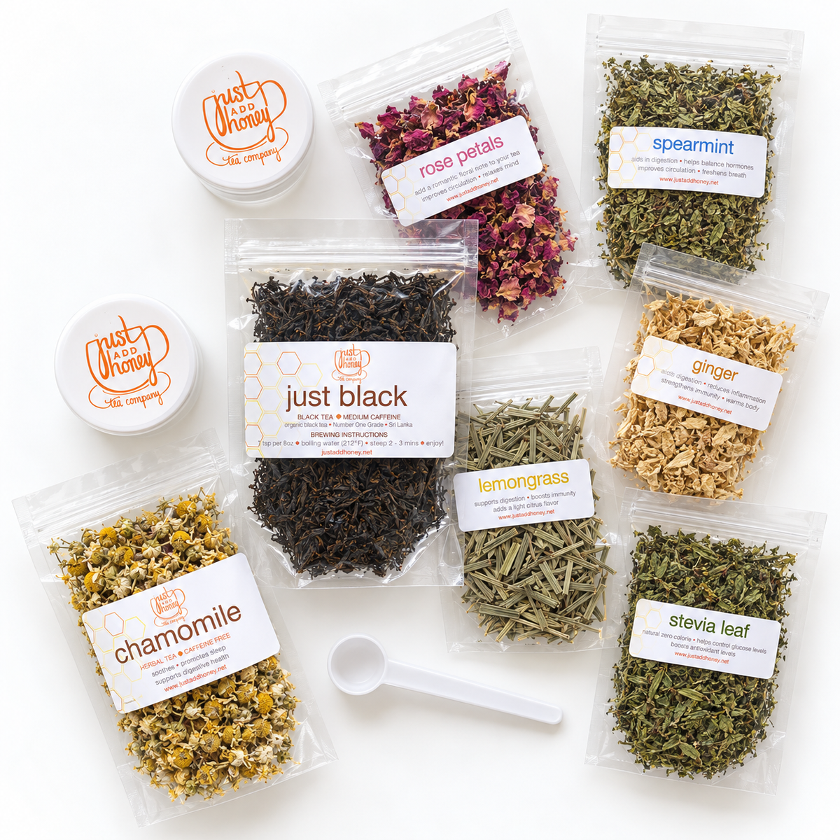 DIY tea kit of two loose leaf teas, five various herbs, teaspoon, and storage containers